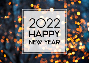 2022 New Year sign on a glowing background. Happy New Year 2022 night defocused lights texture greeting card images